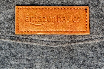 a close up of a leather label on a gray surface