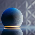 a blue ball on a black surface