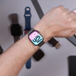 Person wearing smartwatch with iphones and bands