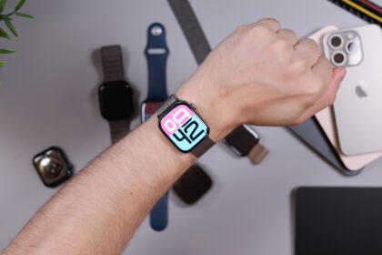 Person wearing smartwatch with iphones and bands