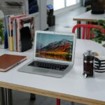 macbook pro on white table