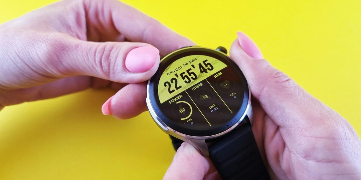 a person holding a small watch