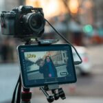 Camera and tablet recording a person on street