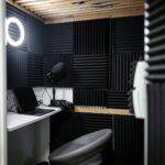 a bathroom with a sink, toilet and a mirror