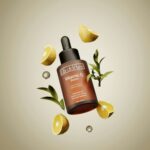 A bottle of vitamin c on top of lemon slices