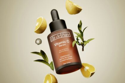 A bottle of vitamin c on top of lemon slices