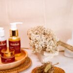 Skincare products are beautifully arranged for a display.