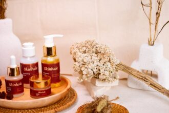 Skincare products are beautifully arranged for a display.