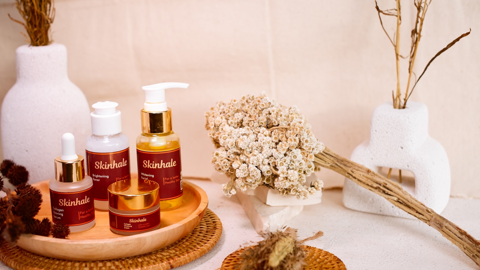 Skincare products are beautifully arranged for a display.