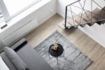 Aerial view of a stylish minimalist loft with modern furnishings and elegant decor.