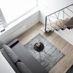 Aerial view of a stylish minimalist loft with modern furnishings and elegant decor.