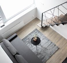 Aerial view of a stylish minimalist loft with modern furnishings and elegant decor.